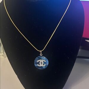 Gold Chain Necklace with Blue Round Pendant and Crystal Logo